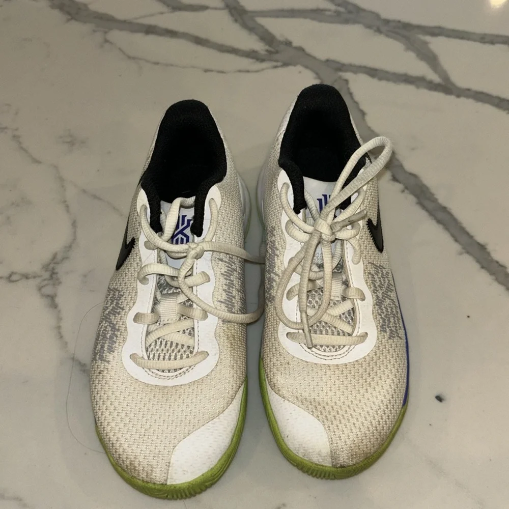 Gently used Nike Kyrie boys sneakers white black lime green and purple size 2.5